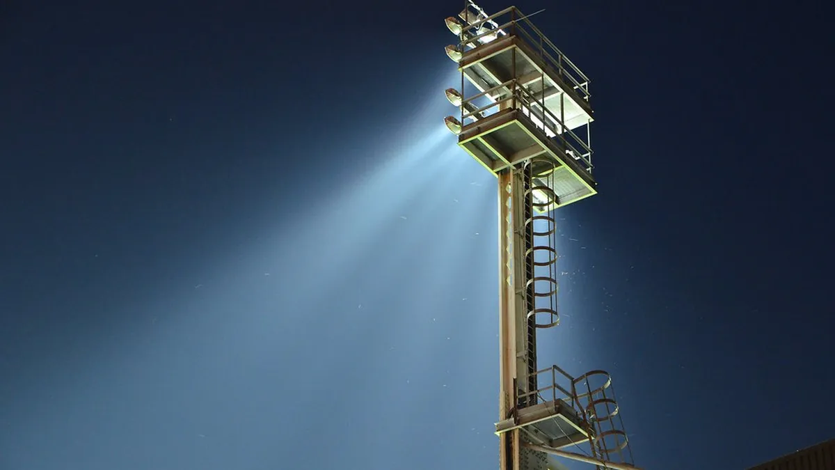 Floodlights over a football ground — the fixtures that drive most of the UK betting calendar.